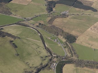 Oblique aerial view centred on the remains of the railway and the area of the demolished railway viaduct, taken from the ENE.