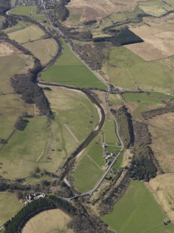 General oblique aerial view centred on the remains of the railway and the area of the demolished railway viaduct, taken from the NNE.