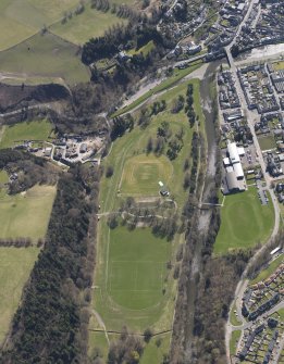 Oblique aerial view centred on the racecourse, taken from the NW.