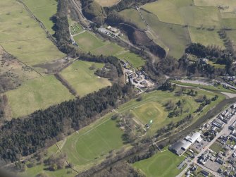 Oblique aerial view centred on the racecourse, taken from the W.