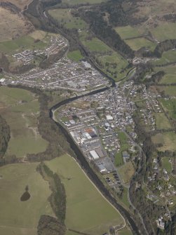 General oblique view centred on the town with the planned village adjacent, taken from the SE.