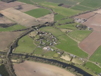 General oblique aerial view centred on the village with the railway viaduct adjacent, taken from the ENE.