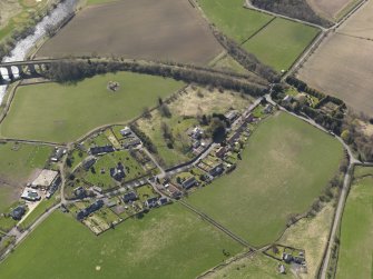 Oblique aerial view centred on the village, taken from the N.