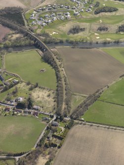 Oblique aerial view centred on the remains of the railway junction with the railway viaduct adjacent, taken from the WNW.