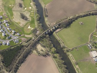 Oblique aerial view centred on the railway viaduct, taken from the NNE.