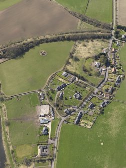 Oblique aerial view centred on the village, taken from the NE.