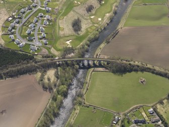 Oblique aerial view centred on the railway viaduct with the housing esatet adjacent, taken from the NNW.