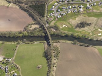 Oblique aerial view centred on the railway viaduct, taken from the W.