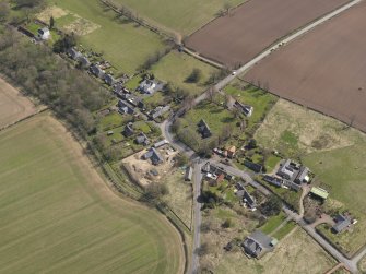 Oblique aerial view centred on the village taken from the WNW.