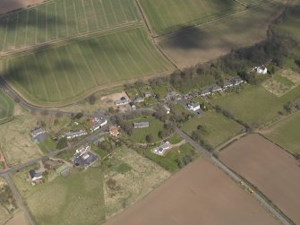 Oblique aerial view centred on the village taken from the SSW.