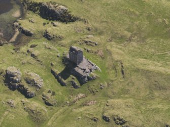 Oblique aerial view centred on the tower-house, taken from the NW.