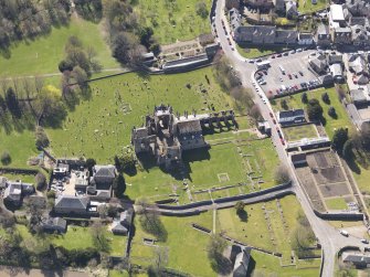 Oblique aerial view centred on Melrose Abbey, taken from the NNE.