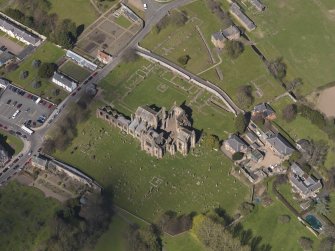 Oblique aerial view centred on the abbey, taken from the SE.