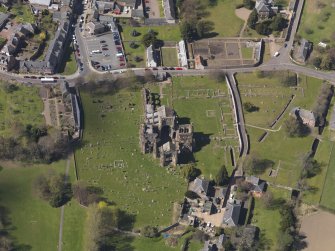 Oblique aerial view centred on the abbey, taken from the E.