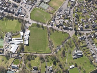 Oblique aerial view centred on the rugby ground, taken from the N.