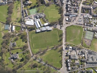 Oblique aerial view centred on the rugby ground, taken from the WNW.