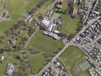 Oblique aerial view centred on the rugby ground, taken from the W.