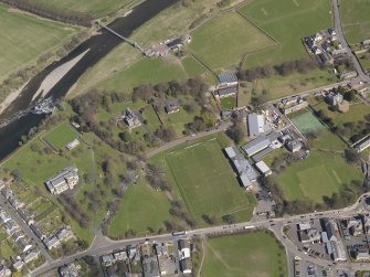 Oblique aerial view centred on the rugby ground, taken from the SW.
