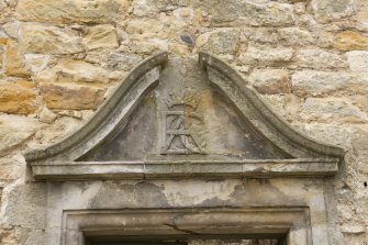 Detail of broken pediment above E entrance