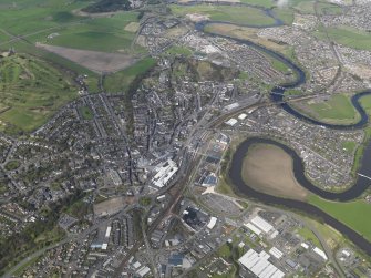 General oblique aerial view of Stirling centred on the railway station, taken from the S.