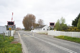 View from SE showing the modern level crossing.