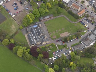 Oblique aerial view centred on the school, taken from the WSW.