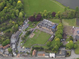 Oblique aerial view centred on the school, taken from the SE.