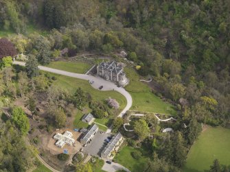 Oblique aerial view centred on the Country House, taken from the NW.