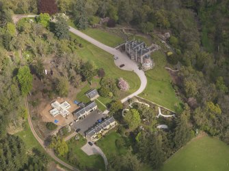 Oblique aerial view centred on the Country House, taken from the WNW.