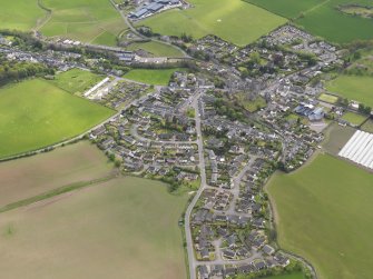 General oblique aerial view centred on the village, taken from the NNE.