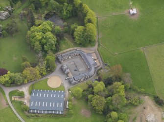 Oblique aerial view centred on the farmstead, taken from the N.