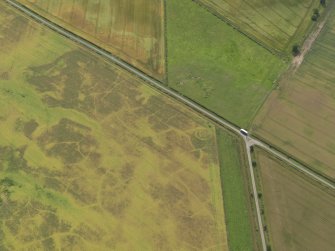 Oblique aerial view of the cropmarks of the barrow, taken from the N.