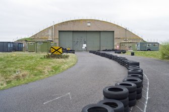 View from ENE of gbale end of L type aircraft hangar (N)  in the SE dispersal area.