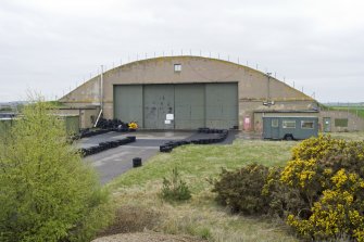 View from NE of gable end of L type aircraft hangar (N) in the SE dispersal area.