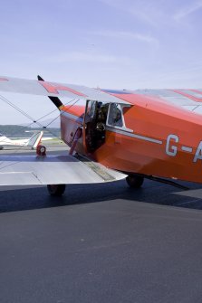 de Havilland DH87B Hornet Moth (G-ADNE) on the apron at Oban Airport (North Connel). Aircraft formerly owned by Ted Fresson.