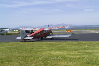 de Havilland DH87B Hornet Moth (G-ADNE) on the apron at Oban Airport (North Connel). Aircraft formerly owned by Ted Fresson.