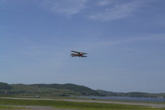 de Havilland DH87B Hornet Moth (G-ADNE) in the air at Oban Airport (North Connel). Aircraft formerly owned by Ted Fresson.