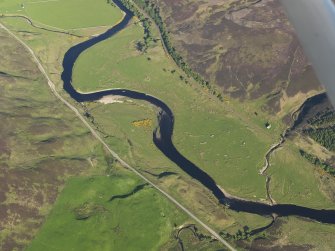 Oblique aerial view of the remains of the hut-circles, township and rig at Ulbster, taken from the NW.