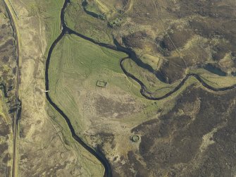 Oblique aerial view of the remains of the farmsteads, enclosures and rig, taken from the NE.