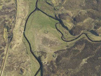 Oblique aerial view of the remains of the farmsteads, enclosures and rig, taken from the N.