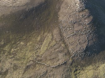 Oblique aerial view of the fort wall and enclosures on Ben Griam Beg, taken from the S.