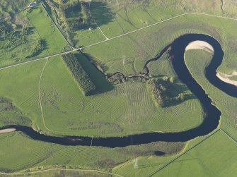 Oblique aerial view of the remains of the rig on the flood plain of the River Brora, taken from the SW.