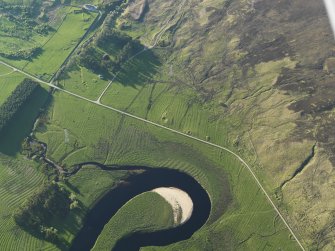 Oblique aerial view of the remains of the rig on the flood plain of the River Brora and the remains of the township buildings and possible henge, taken from the S.