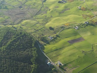 Oblique aerial view of the barrow at Knock Dhu with Balcharn beyond, taken from the S.