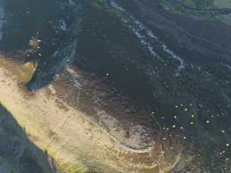 Oblique aerial view of the remains of the unfinished fort at Cnoc an Duin, taken from the NW.