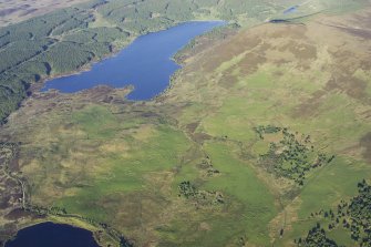 General oblique aerial view of the buildings, dykes, rig and hut-circles at Dola looking towards Loch Craggie, taken from the W.