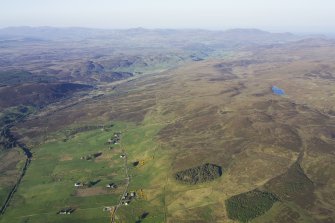 General oblique aerial view looking across Rhian Breck and Tomich towards Strath Fleet, taken from the W.