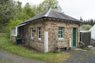View from SE of ticket and goods office showing side passage for ticket window, Stobs railway station
