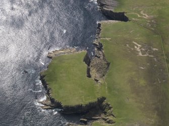 Oblique aerial view centred on Lambhoga Head and the remains of the possible fort and the buildings, taken from the NNW.