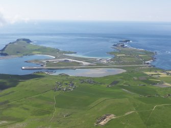 General oblique aerial view looking across Exnabol towards the Pool of Virkie  and Sumburgh Airport, taken from the NE.